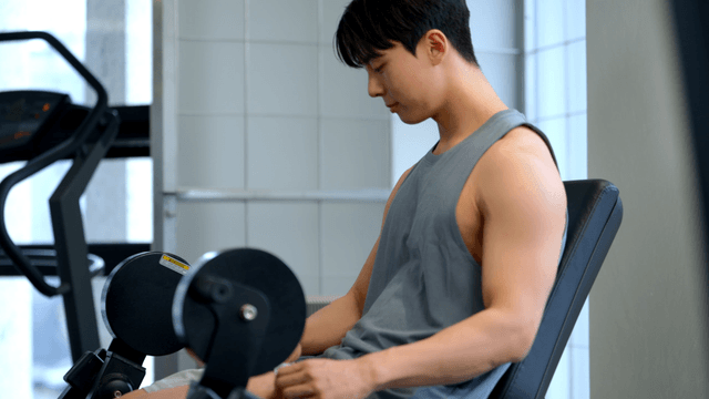 Man exercising in a gym with focus