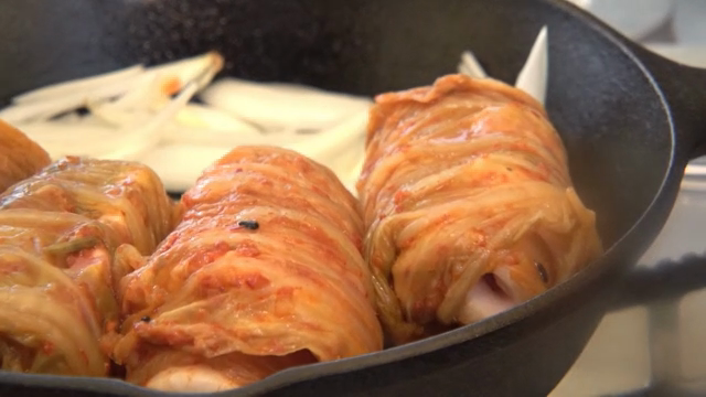 Kimchi wrapped pork on a pan