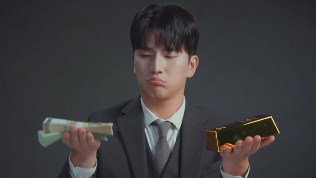 Man in a suit weighing money and gold