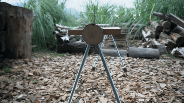 Handcrafted wooden bench placed by the grass