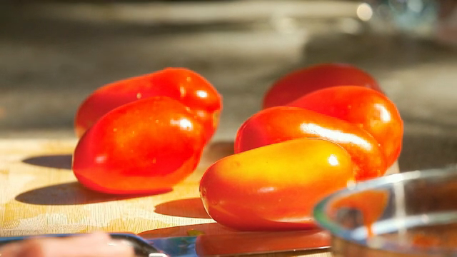 Fresh tomatoes on a cutting board