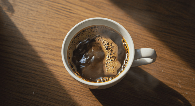 Pouring hot coffee into a mug