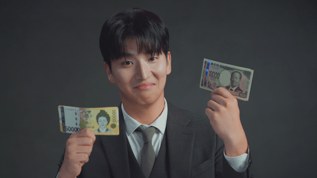 Man comparing Korean won and Japanese yen