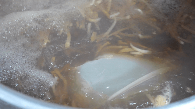 Thick broth boiling in large pot