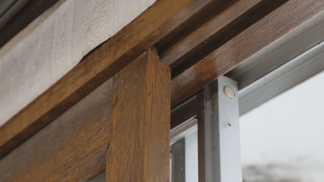 Wooden window frame with intricate design