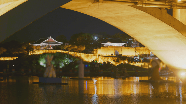 Night view featuring Korean fortress and pavilion