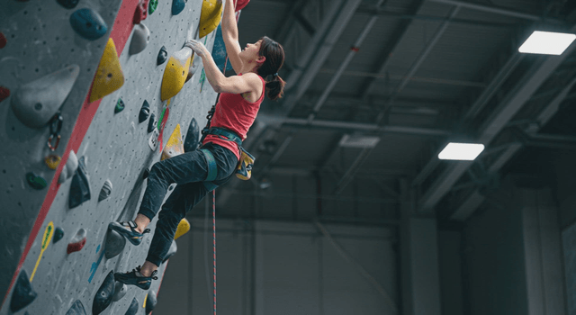 Woman indoor climbing
