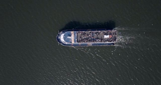 A ferry carrying passengers on the sea
