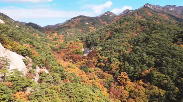 Colorful autumn mountains with a temple