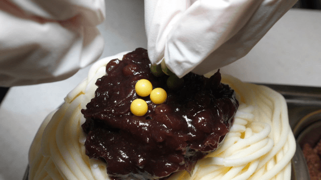 Decorating a dessert with colorful toppings