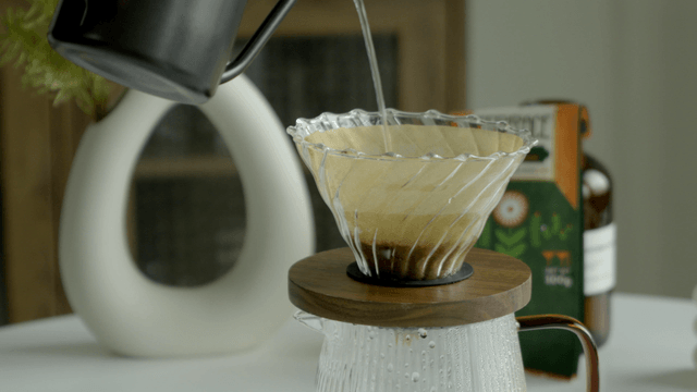 Pouring water into a coffee dripper