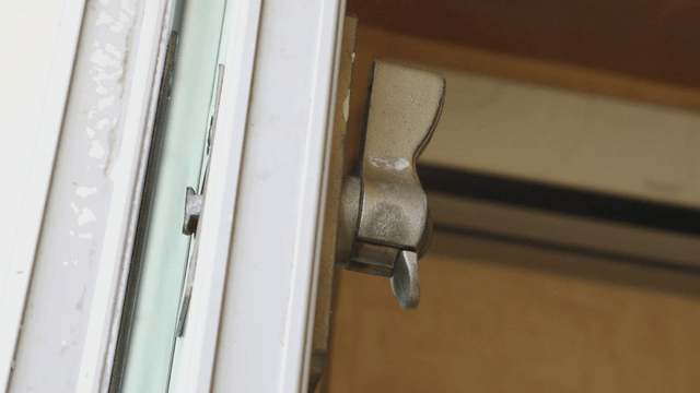 Close-up of a window latch indoors
