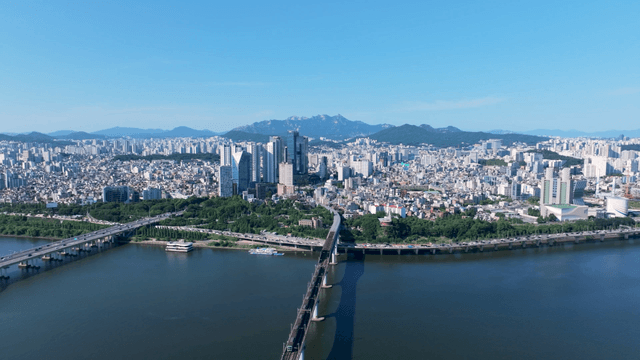 Seoul cityscape with a train crossing the Han River