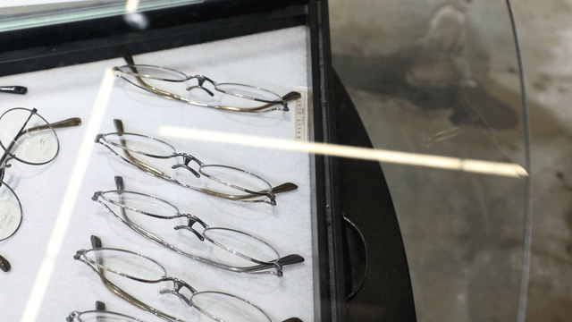 Cleaning glasses from a display case