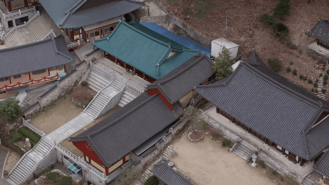 Traditional Korean temple surrounded by trees