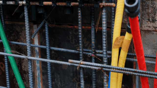 Colorful cables and rebar at a construction site