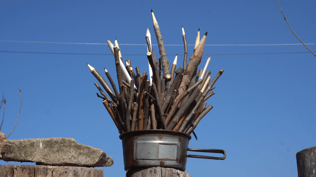 Wooden pencil sculpture under the clear sky