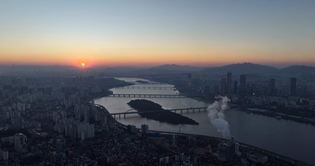 City skyline with river at sunset