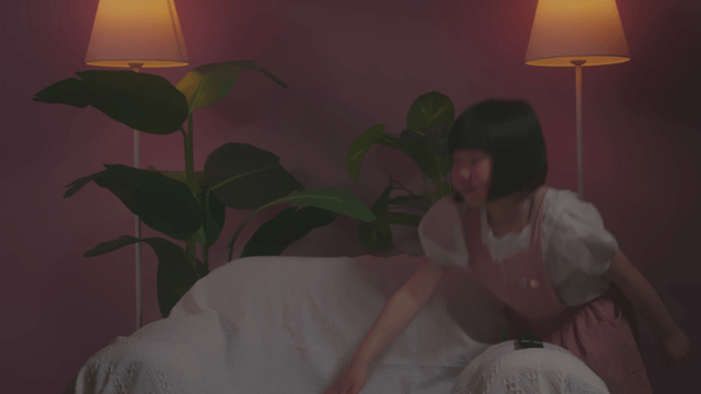 Girl sitting an adult on a sofa in a cozy room