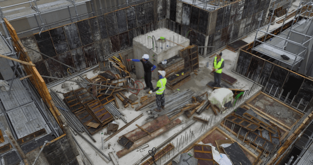 Construction site with workers and scaffolding