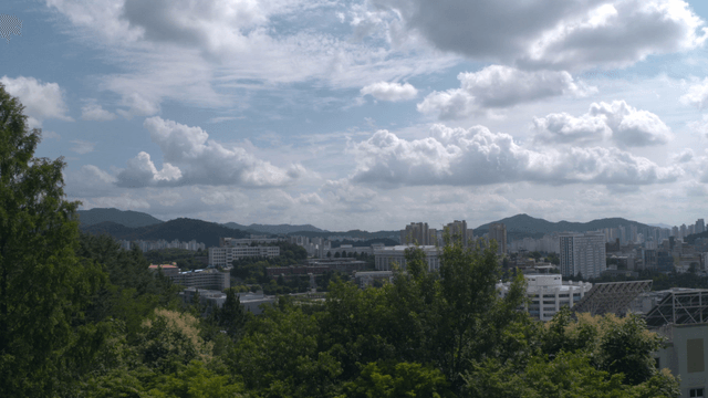 A cityscape with surrounding mountains