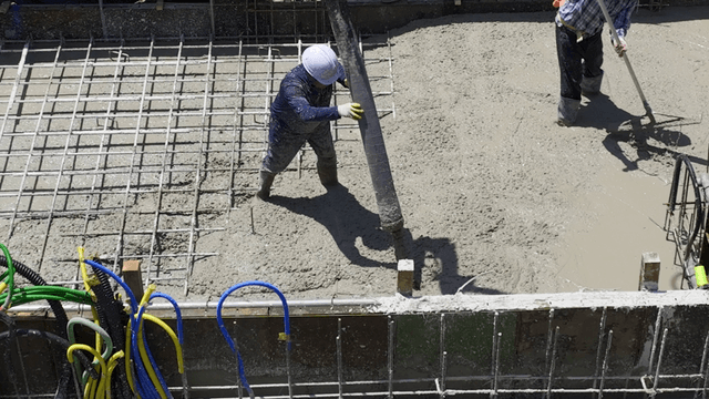 Concrete being poured at a construction site