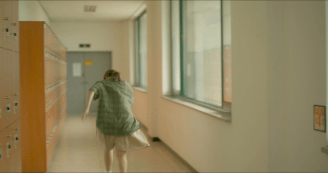 Woman running out after discovering something