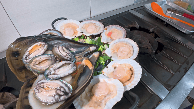 Fresh chicken and seafood soup prepared in the kitchen