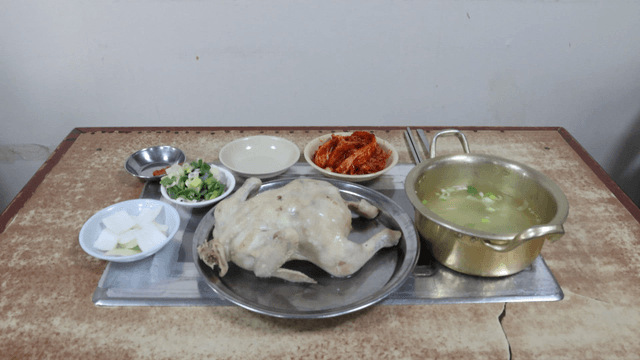 Chicken soup served with side dishes