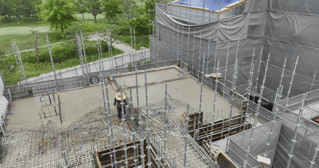 construction site with scaffolding and worker