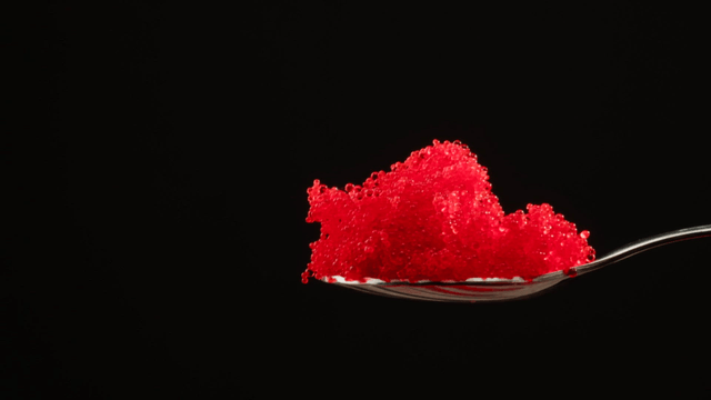 A spoonful of red flying fish roe