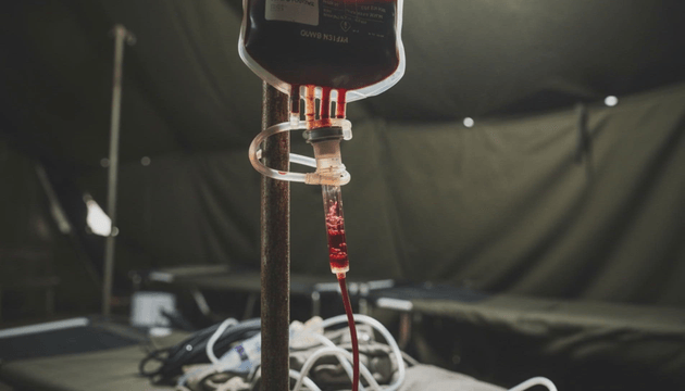 Blood transfusion bag in a medical military tent
