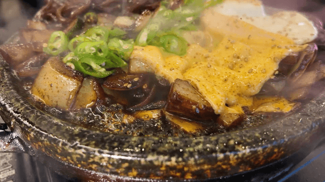 Sizzling cheese jajangmyeon on hot iron plate