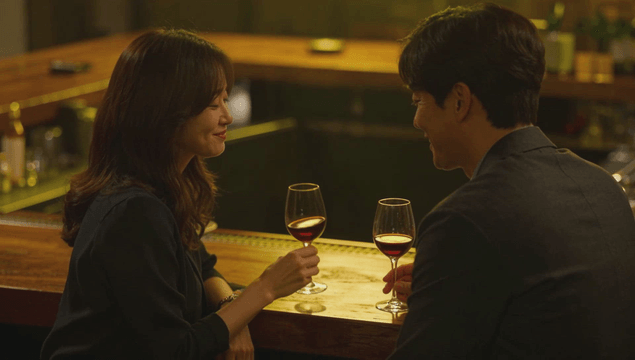 Couple enjoying wine in a cozy bar