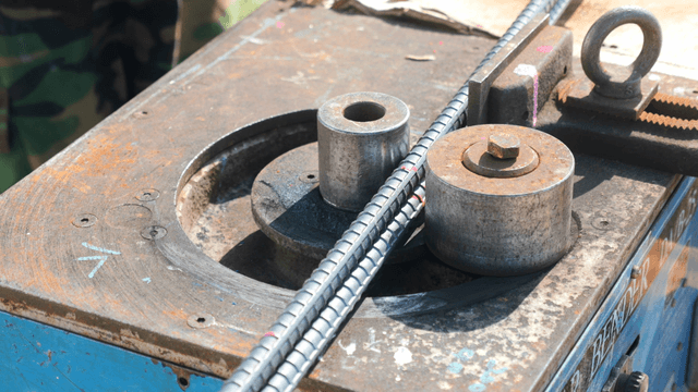 Metal bending machine in operation
