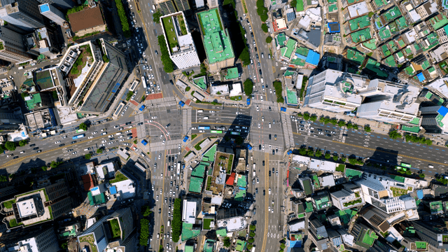 A bustling city intersection with traffic