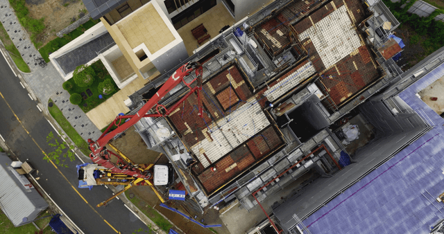 Construction site with a worker and a crane