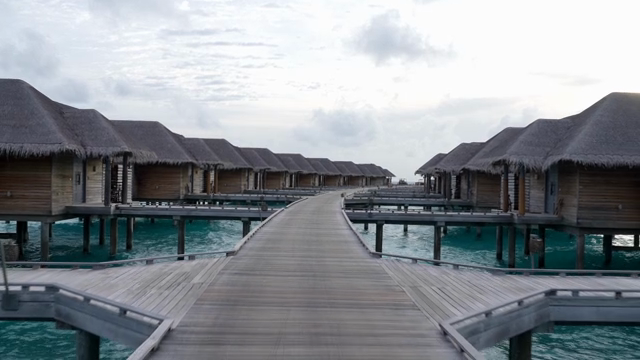 Overwater bungalows with a wooden walkway