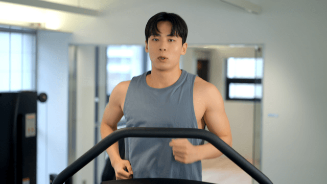 Man jogging on a treadmill at gym