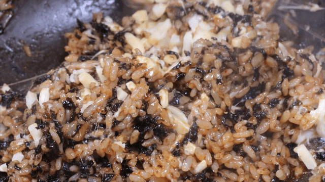 Cheese and seaweed fried rice being mixed