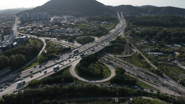 Highway intersection with surrounding cityscape