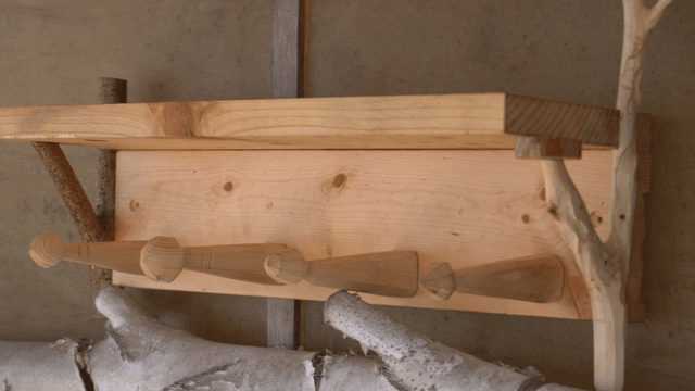 Wooden shelf stand with natural branches on top