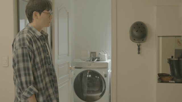 Man seeing woman off as she leaves home