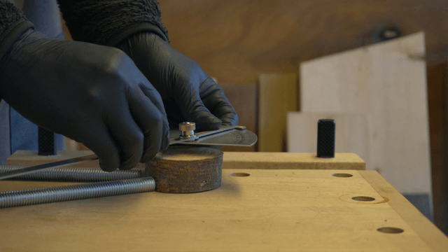 Woodcraft artisan cutting wood on workbench