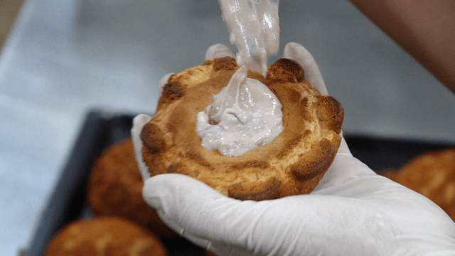 Cream being filled into a pastry