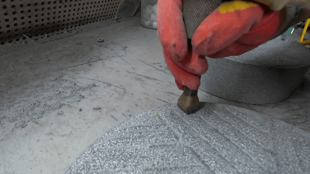 Polishing machine handling a basalt millstone