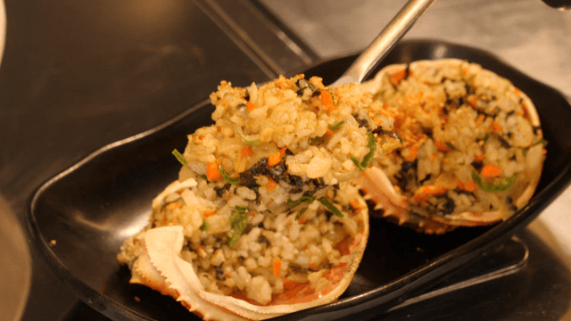 Spoonful of Seasoned Rice in Crab Shell