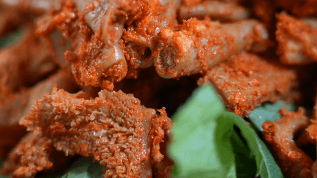 Seasoned beef intestines on perilla leaf