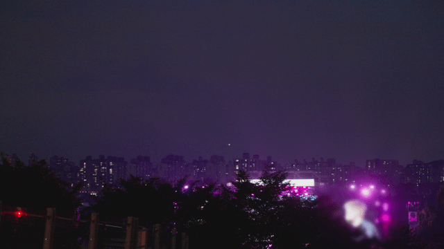 City nightscape with vibrant concert lights