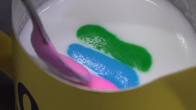 Colorful latte art being created